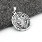 Close-up view of a stainless steel pendant depicting Jesus Christ for daily faith wear