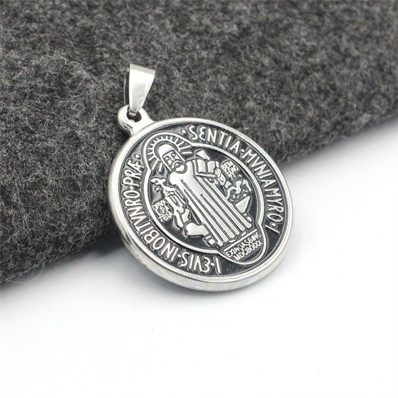 Close-up view of a stainless steel pendant depicting Jesus Christ for daily faith wear