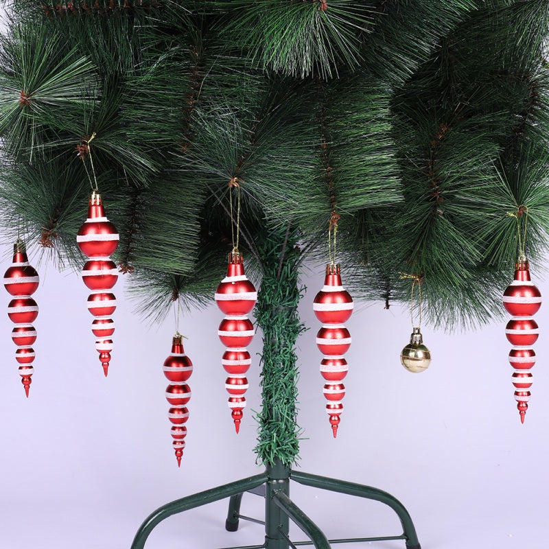 Painted gourd ball ornament hanging on a Christmas tree