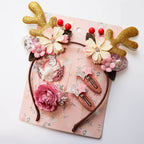 Close-up view of children's Christmas hair accessories featuring winter colors