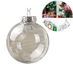 Transparent Christmas ornament ball catching light on a Christmas tree