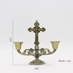 Soft candlelight beside the cross creating peaceful home atmosphere