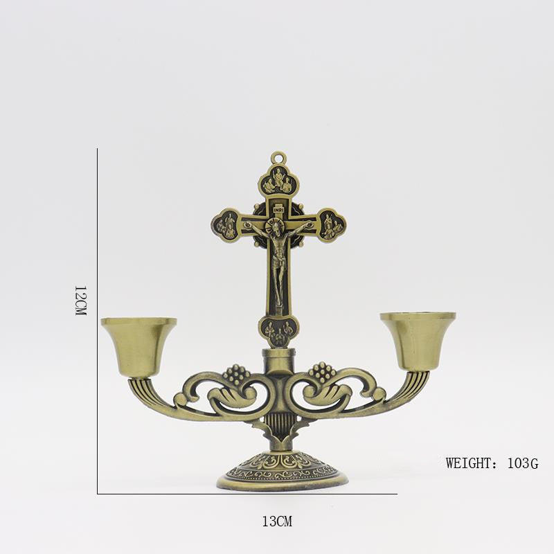 Soft candlelight beside the cross creating peaceful home atmosphere