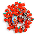 Close-up of red clay prayer beads on round chain