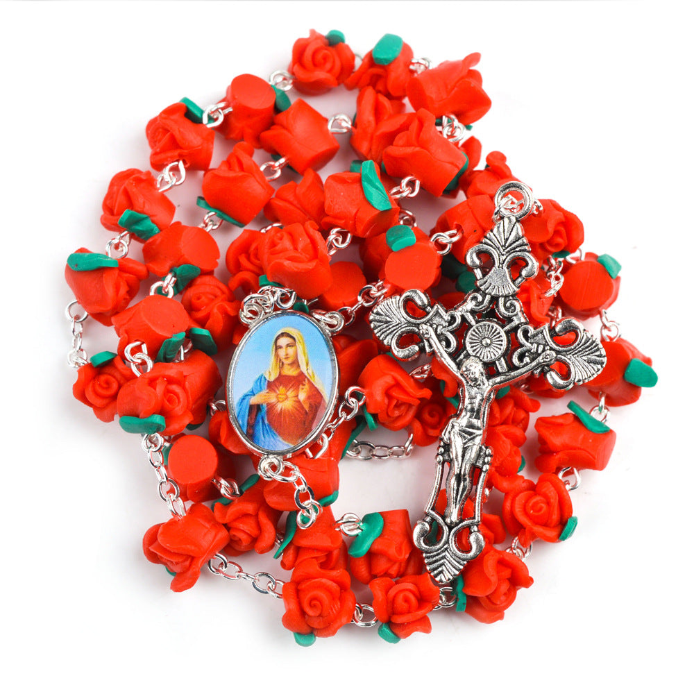 Close-up of red clay prayer beads on round chain