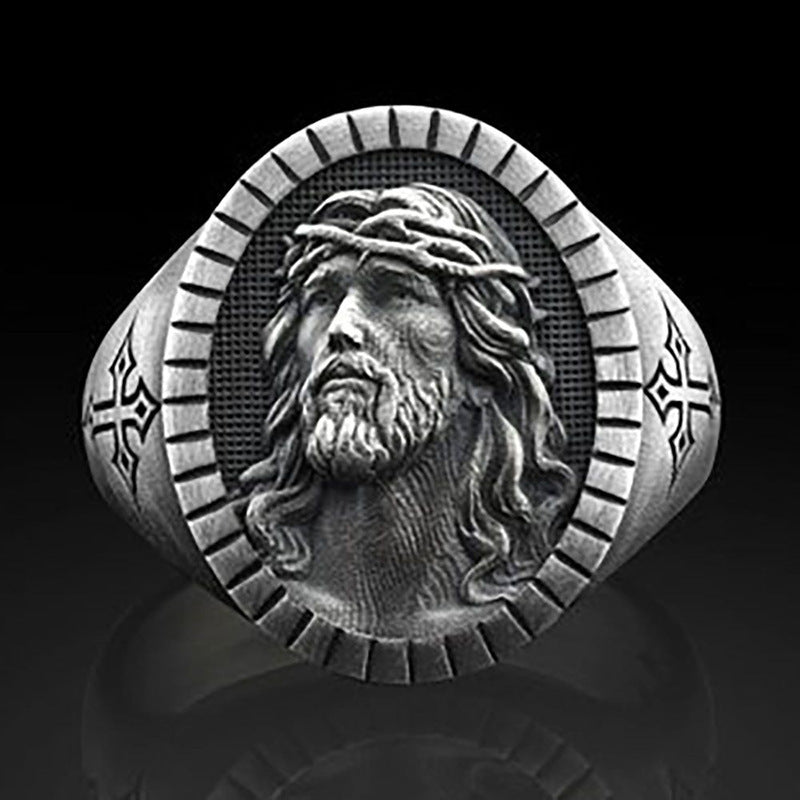 Men's ring showing cross and religious symbolism