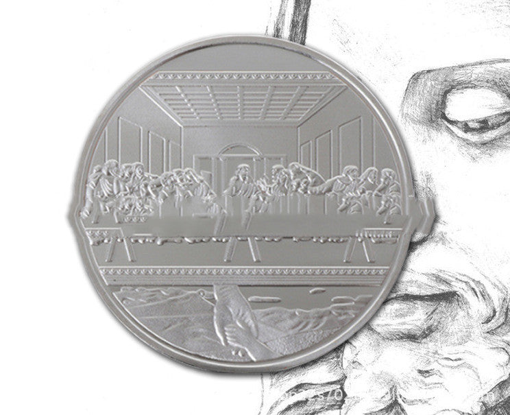 Close-up of Jesus Christ religious medallion detail on gold-tone coin