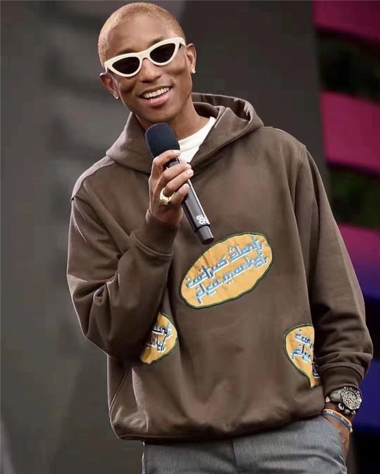 Young believer wearing brown cotton hoodie with Jesus Is King print