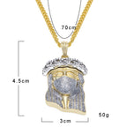 Close-up of masked Jesus figure pendant detail