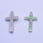 Christian pendant detail showing polished metal finish and symbolic imagery