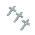 Luminous cross pendant displaying intricate religious craftsmanship