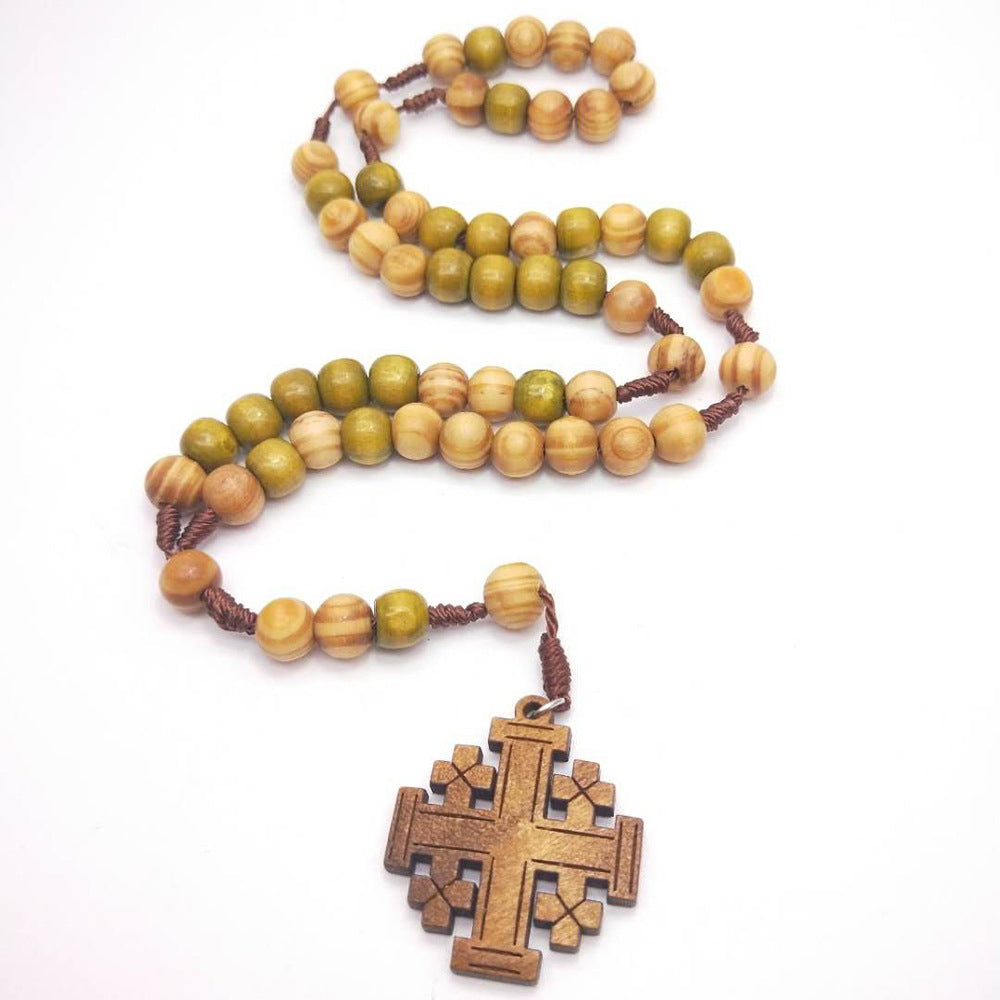 Wooden beads detail on rosary prayer necklace