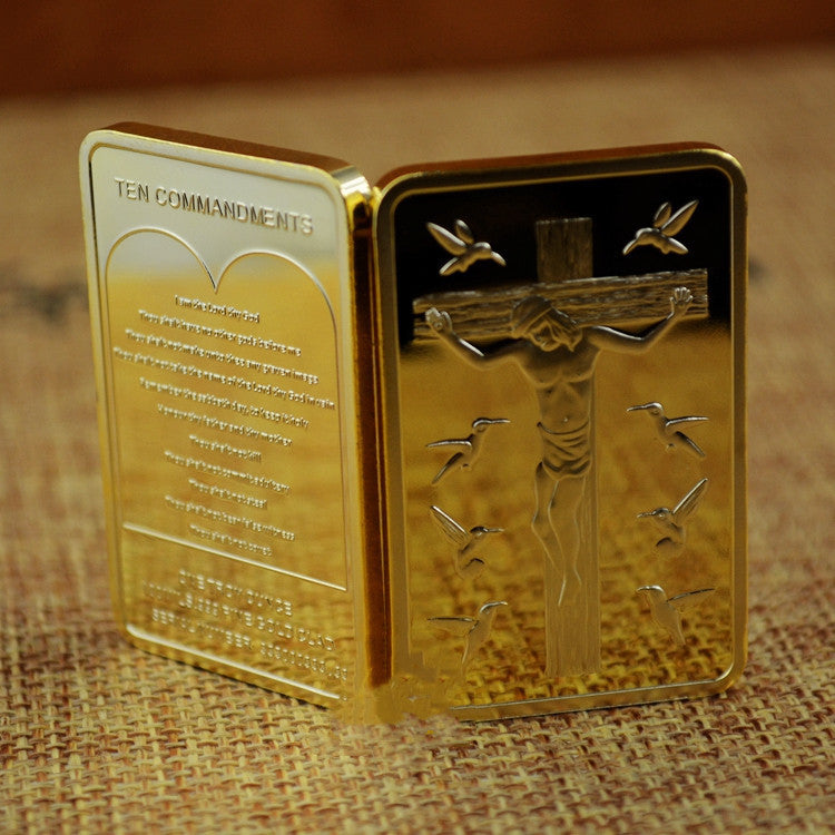 Set of multiple Jesus Cross commemorative coins in packaging