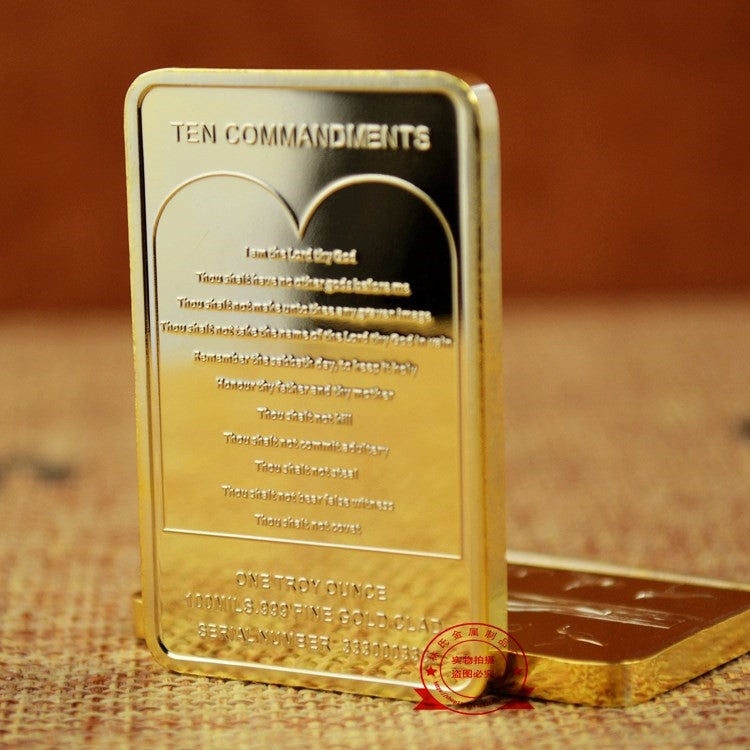 Golden Jesus Cross commemorative coin displayed in acrylic case
