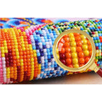 Close-up of colorful resin rhinestones arranged in diamond painting pattern