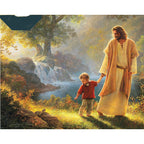 Completed diamond painting showing serene religious scene ready for display