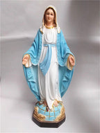 Sacred Heart of Jesus resin statue displayed on wooden shelf for home prayer space