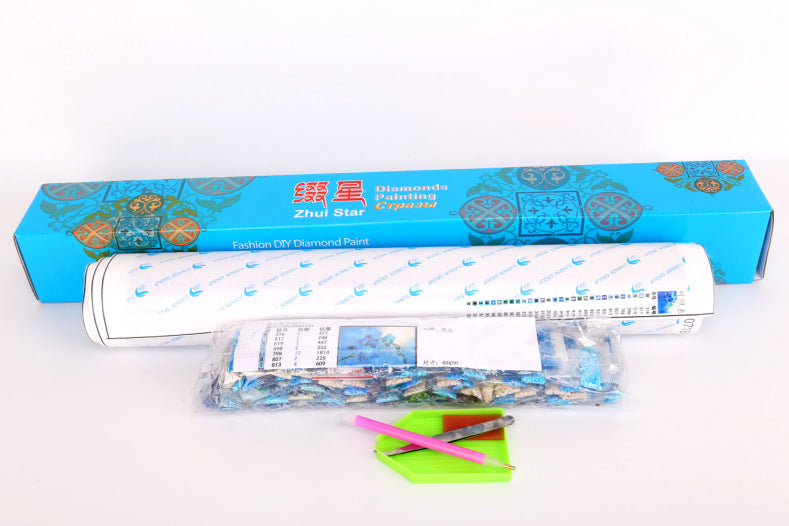 DIY diamond painting supplies and tools on wooden table