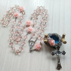 Cross necklace with adjustable chain in soft pink metal alloy
