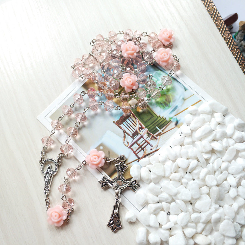 Stylized view of pink alloy cross pendant necklace for faith