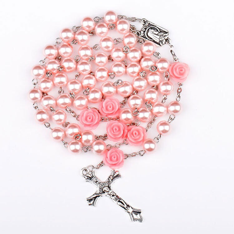 Cross necklace displayed on elegant jewelry stand