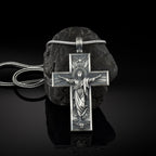 Jesus cross pendant necklace on silver chain close-up