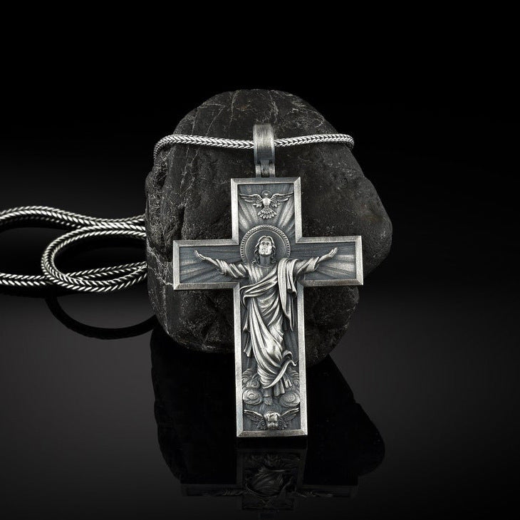 Jesus cross pendant necklace on silver chain close-up