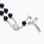 Bracelet laid flat showing rosary design and beads