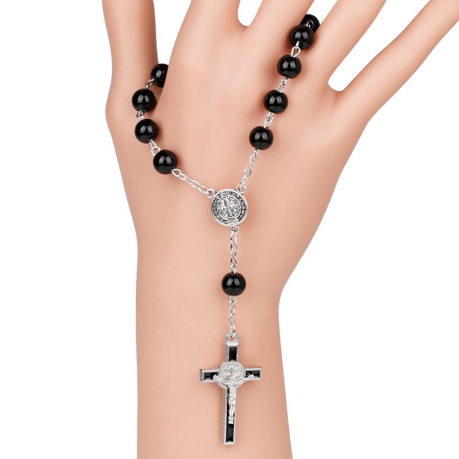 Wrist shot of rosary bracelet being worn