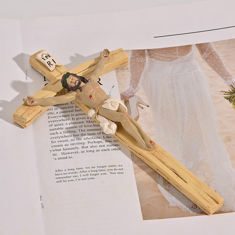 Close-up of Jesus crucifix figure on cross wall hanging ornament for faith decor