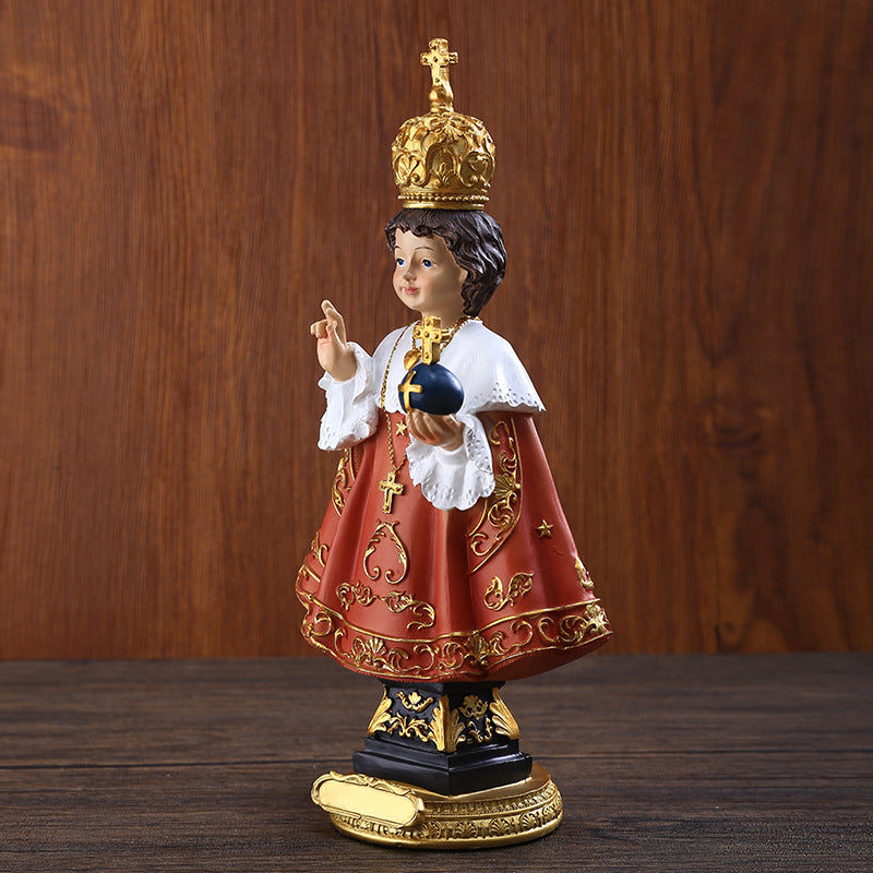 Close-up detail of Catholic resin statue ornament showing faith craftsmanship
