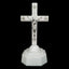 Glowing cross ornament with warm light against dark background