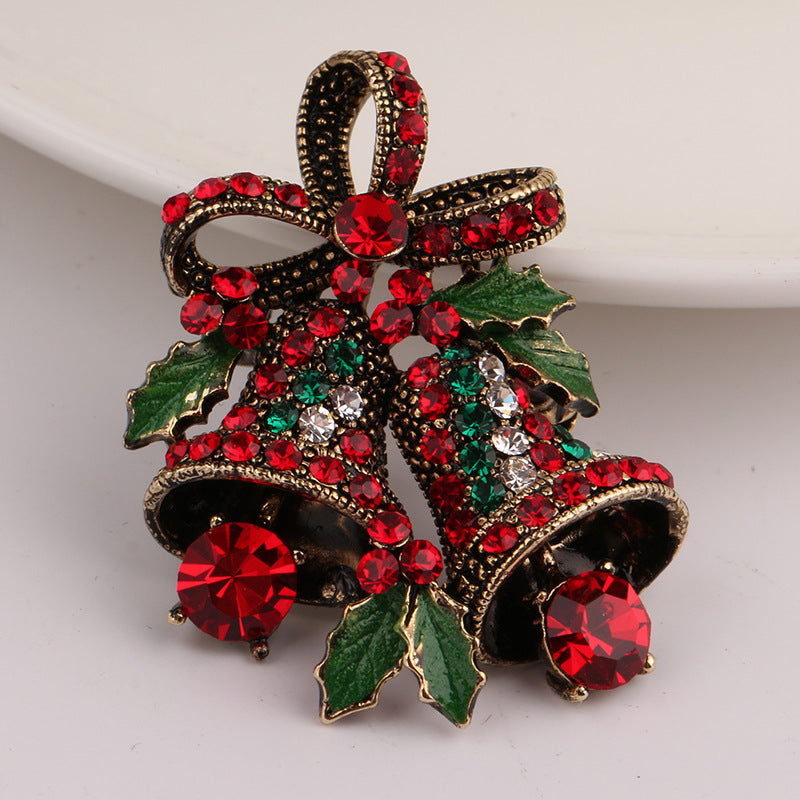 Women's Christmas brooch with intricate alloy design and gem inlay