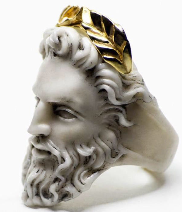 Close-up view of a vintage Jesus ring with detailed Christian imagery
