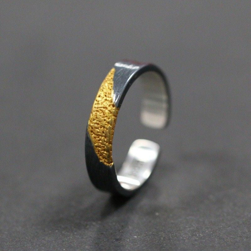 Adjustable open band detail of men's cross ring
