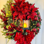 Christmas light wreath with sacred Jesus centerpiece displayed in festive home setting