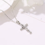 Simple women's faith necklace featuring cross and leaf pendant
