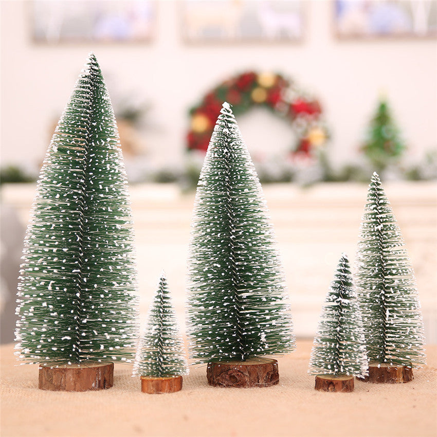 Small green and white pine needle Christmas tree decoration on white background