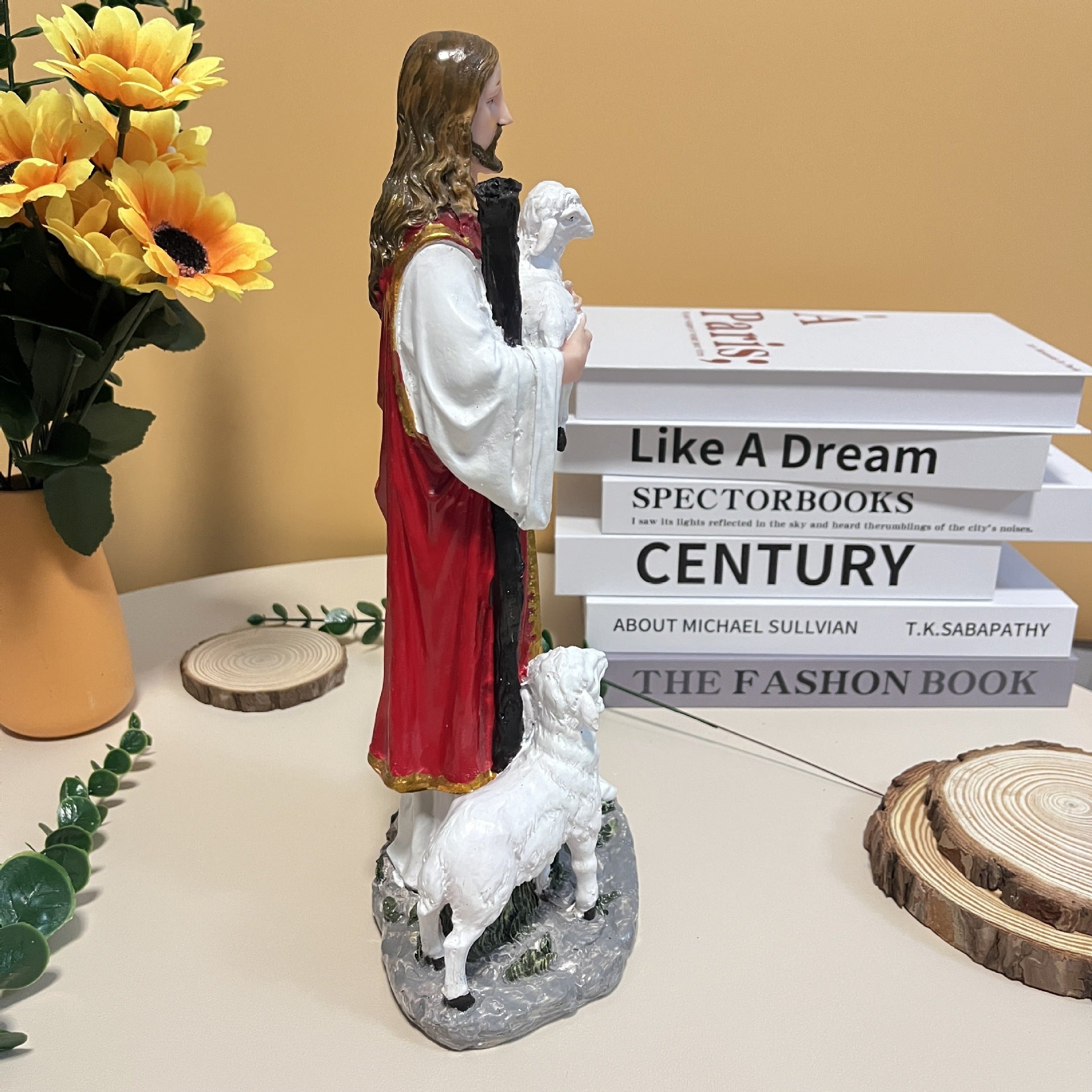 Resin nativity ornament showing infant Jesus in rustic wooden manger setting