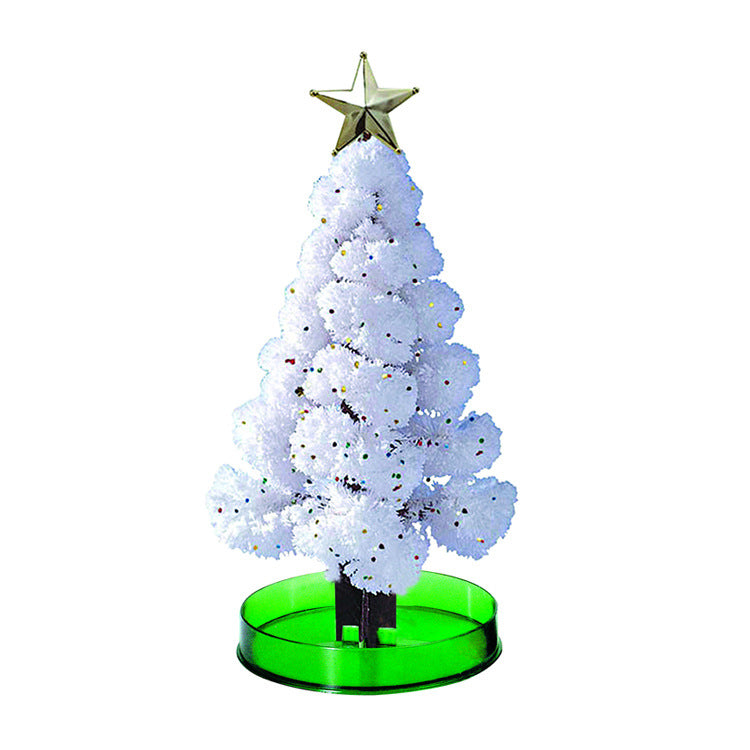 Close-up of paper Christmas tree branches spreading open after water is added