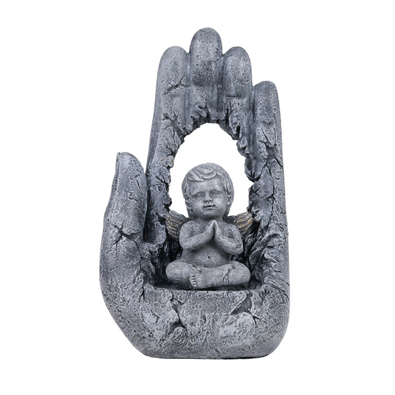 Detailed view of hand-painted resin Jesus prayer figurine with palm branches