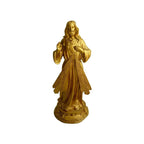 Divine Mercy sculpture with radiant gold coloring and serene expression