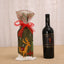 Festive Christmas wine bottle cover with ribbon snowman design for holiday celebrations