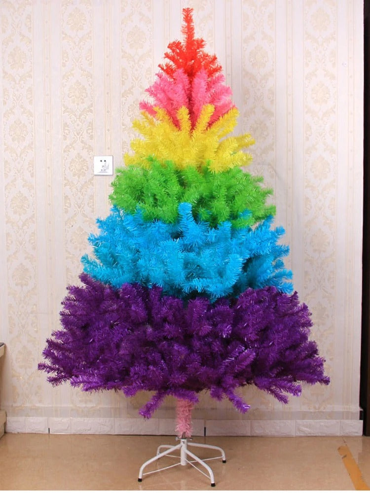 Rainbow Christmas tree in church fellowship hall with candles nearby
