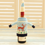 Set of four knitted Christmas bottle covers in various festive designs