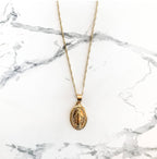 Devotional Mother Mary medallion pendant with religious symbolism