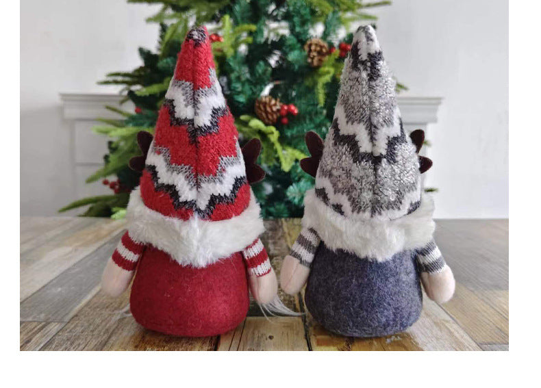 Gray and red deer dolls with pointed hats displayed together in holiday harmony