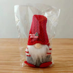 Festive red and gray pocket doll Christmas ornaments on display