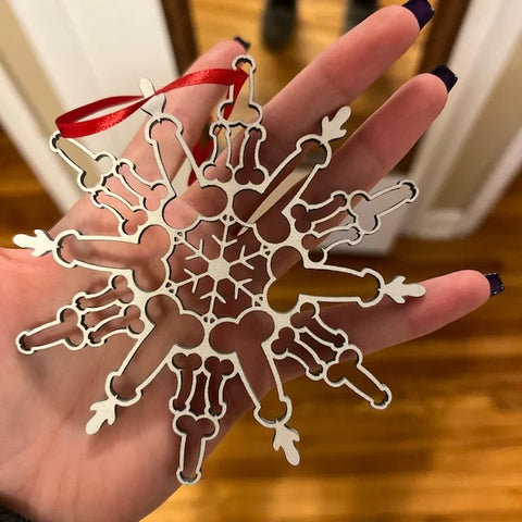 Two snowflake pendant ornaments showing decorative design detail