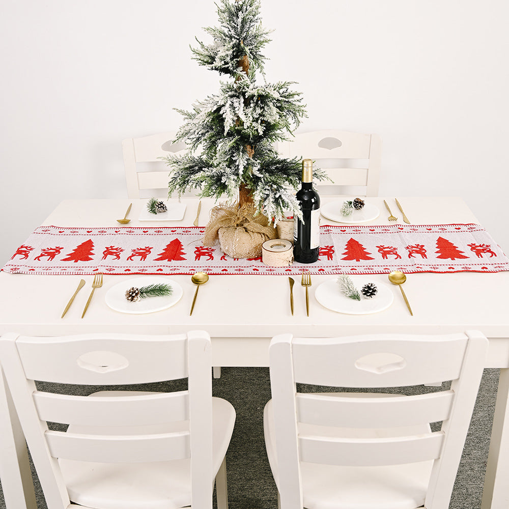 Close-up of electric embroidered knit texture on Christmas table runner